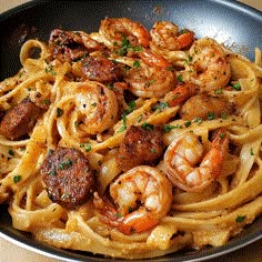 pasta with shrimp and sausage in a skillet