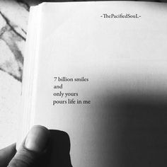 a person holding an open book in their hand with the words, billion smiles and yours pours life in me