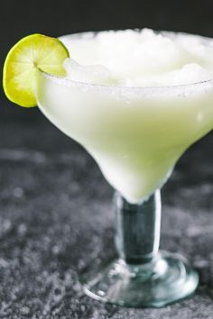 a margarita cocktail garnished with a lime slice