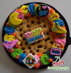 a birthday cake decorated with cookies and decorations