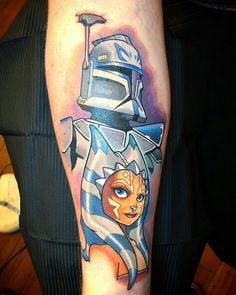 a star wars tattoo on the arm of a person with a boba fett helmet