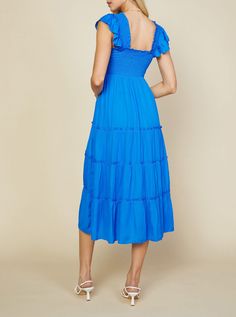 This breezy, lush midi dress is just what you've been waiting for. Featured with a stunning square neckline, smocked bodice, flutter sleeves, a tiered skirt, and the most flattering midi length. With the smocked bodice hugging the silhouette just right, you're sure to love the fit of this style. Be the best dressed to your next event or night out in this vivid blue midi dress. vivid blue smocked bodice square neckline tiered skirt woven midi dress fits true to size 100% polyester Model is 5'8 1/ Tiered Midi Dress, Mid Dresses, Flowy Skirt, Blue Midi Dress, Sweet Dress, Tier Skirt, Tiered Dress, Sheer Fabrics, Flutter Sleeve