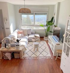 the living room is clean and ready to be used as a den or office space