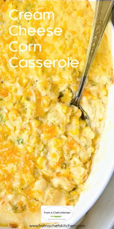 a close up of a casserole in a bowl with a spoon on the side