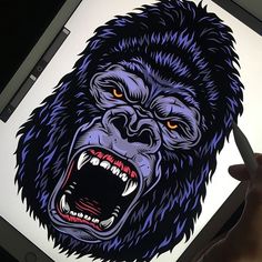 a drawing of a gorilla with its mouth open and teeth wide open, on a laptop screen