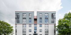 an apartment building with several windows and balconies