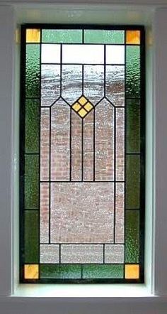 a close up of a stained glass window in a building's front entrance door