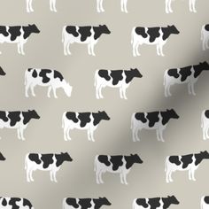 a black and white cow pattern on a gray background