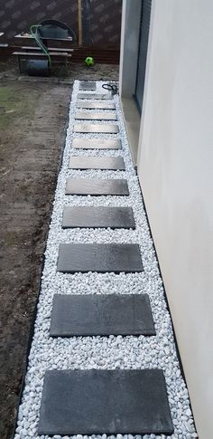 a walkway made out of stones and gravel