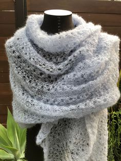 "HAND KNITTED DELICATE LACE SHAWL  The color is light blue  Italian yarn. 70% S. Kid Mohair and 30 % Silk  Extremely delicate knitting in lacy pattern. Measurements are approximately 80\" long 42\"wide It's weight is about 0,23 lb ( 110 gr.) Mohair /ˈmoʊhɛər/ is usually a silk-like fabric or yarn made from the hair of the Angora goat. Both durable and resilient, mohair is notable for its high luster and sheen, which has helped give it the nickname the \"Diamond Fiber\", and is often used in fibe Hand Knitted Blue Shawl One Size, Handmade Mohair Shawl Scarf, Mohair Shawl, Angora Goat, Scarf Summer, Blue Shawl, Angora Goats, Lace Shawl, Shawl Scarf