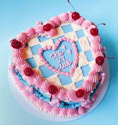 a heart shaped cake on a blue table