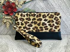 "An exterior zipper pocket can be added for an additional cost. Please message me prior to purchasing this listing. This cute wristlet wallet is the perfect go to alternative to our everyday handbags! It will hold all your necessities including credit cards, ID and your smartphone. Super convenient for the mom on the go!! This sleek and contemporary wristlet clutch was designed using a leopard print fabric. It has a faux black leather base and a detachable strap. The well organized interior is a Pouch Wristlet As Gift, Wristlet Pouch With Wrist Strap As Gift, Pouch Wristlet With Wrist Strap As Gift, Gift Wristlet Clutch With Wrist Strap, Gift Clutch Wristlet With Wrist Strap, Gift Wristlet With Wrist Strap, Brown Wristlet With Zipper Pouch For Gift, Brown Wristlet With Zipper Pouch As Gift, Adjustable Wristlet With Wrist Strap