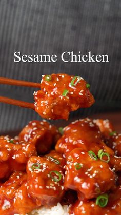 sesame chicken with chopsticks on top of rice