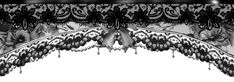 black and white photograph of an ornate curtain with flowers on the side, in front of a window