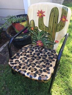 a chair that has been painted to look like a cactus sitting on top of it