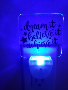 a light up toilet with the words dream it, believe it, and be quiet written on it