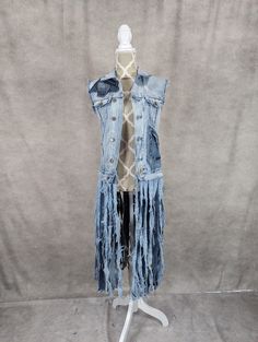 "Upcycled long distressed denim vest with cross detail on the back and frayed denim detail and pocket on the front.Frayed Fringe hem.  Bust measures 36\" and length is approximately 48\"." Long Denim Vest, Denim Fringe, Recycled Clothes, Fringe Vest, Denim Ideas, Long Fringe, Long Fringes, Blue Jean Jacket, Frayed Denim