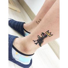 a woman's legs with a tattoo on them