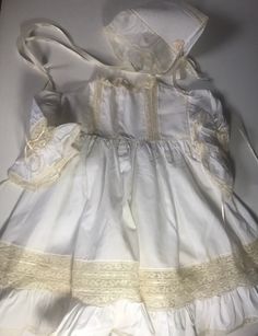 "Amazing beyond belief pictures due this no justice/sleeve length 5 1/2\"/pit to pit 12 1/2\"blouson/length (shoulder to bottom) 19 1/4\"/Comes with a matching bonnet/no issues spotless/A one of a kind gown/Amazing Seamstress /smoke free environment/3 plastic snap buttons on back(6)" Pastoral Cotton Dresses With Lace Trim, Spring Vintage Dress With Ruffles For Costume, Cotton Cottagecore Dress For Vintage-inspired Fashion, Vintage Cotton Prairie Dress For Costume, White Cotton Victorian Dress Costume, Vintage Fashion Cotton Dresses With Ruffles, Cotton Ruffle Dresses For Vintage Fashion, White Victorian Dress For Spring Costume, Vintage Cream Victorian Dress For Summer