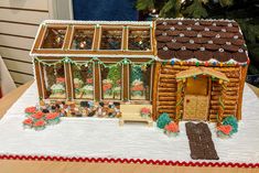 a decorated gingerbread house on top of a table