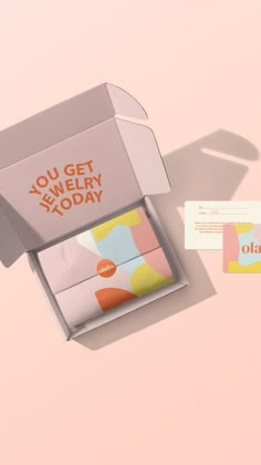 an open box with the words you get jewelry today printed on it next to a business card