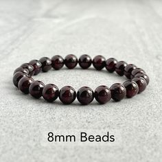 Men's beaded bracelet features: ~ 4mm or 6mm, 8mm or 10mm garnet beads ~ Stretchy cord; simply slide bracelet on and off wrist ~ Comes packaged in a re-usable microfiber pouch. To ensure the perfect fit, please use the bracelet sizing instructions found in the photo gallery. Adjustable Burgundy Round Bead Bracelets, Garnet Bead Bracelet, Slide Bracelet, Gemstone Beaded Bracelets, Mens Beaded Bracelets, Beaded Stretch Bracelet, Of The Earth, Gemstone Bracelet, Stretch Bracelet