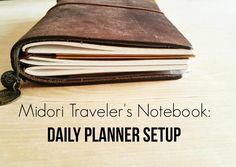 a notebook with the title midori traveler's notebook daily planner setup on it