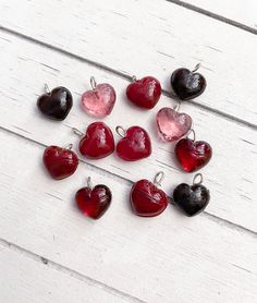 Glass Heart Shaped Charm Drops in Assorted Red/Pink Colors Size 10mm or 14mm An assortment of heart shaped charm drops made of glass, in different shades of red and pink. The charms have a flexible silver loop that you can close to attach these items to jewelry or other crafts that you are making. The charms come in size 10mm OR 14mm (your choice). Package Size Options Include: -5 Charms -10 Charms PLEASE NOTE: The images are enlarged to show the details of the charms so that you can get a bette Different Shades Of Red, Glass Heart, Brown Bags, Shades Of Red, Color Splash, Pink Color, Gift Tags, Heart Shapes, Charms