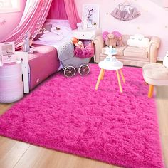 a bedroom with pink carpet and furniture in it's center, including a baby crib