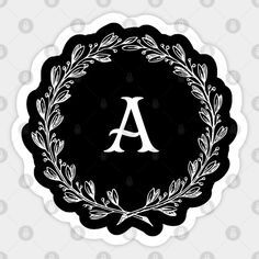 a monogrammed wreath with the letter a in it