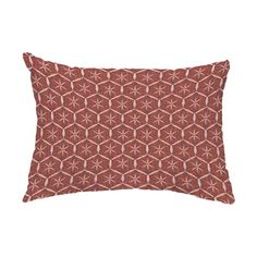 a red and white pillow with an intricate design on the front, sitting on a white background