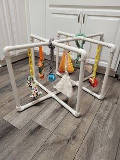 a white play set with toys on the floor