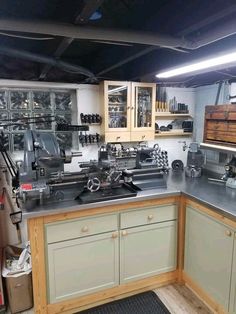 a kitchen filled with lots of appliances and cabinets