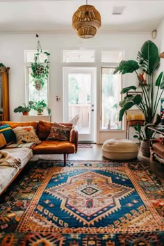 a living room filled with furniture and plants