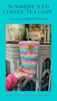 a cup with a straw in it and the text sunshine iced coffee / tea cozy free crochet pattern