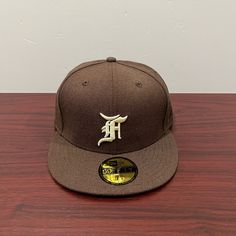 Brand - New Era X Fear Of God Hat Model - 59fifty Hat Type - Fitted Color - Brown & White Condition- Brand New Sizes Available 7, 7 1/2, 7 1/4, 7 1/8, 7 7/8 Flat Crown Fitted Hat For Streetwear And Baseball Season, Classic Flat Crown Fitted Hat For Baseball Season, Flat Cap For Baseball Season Streetwear, White Flat Cap For Baseball Season, Brown Snapback Hat For Baseball Season Streetwear, Classic Flat Crown Hat For Baseball Season, Brown Fitted Baseball Cap, Classic Brown Baseball Cap For Streetwear, Brown Flat Brim Baseball Cap For Sports