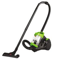 a green and black vacuum cleaner on a white background