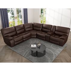 a brown leather sectional sofa sitting on top of a gray rug in a living room