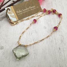 This is a pretty necklace that looks good with a black top or a "power" suit. It looks great on all complexions. The gemstones are AAA in quality. Stunning prasiolite (green amethyst) pendant, measuring 23mm x 23mm. The prasiolite pendant is cushion cut and transparent. The pendant hangs from a 14K GF chain, adorned with 6mm fuchsia rondells. Faceted Green Amethyst Necklace As A Gift, Faceted Green Amethyst Necklace Gift, Gift Green Amethyst Faceted Necklace, Green Amethyst Gemstone Necklace, Gold Necklace With Green Amethyst Gemstone, Green Faceted Amethyst Jewelry, Green Amethyst Necklace For Gift, Green Amethyst Jewelry, Fuchsia Necklace