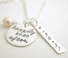 "Live \"happily ever after\" with this personalized sterling silver necklace. Personalized with your custom wedding date. \"happily ever after.\" is hand stamped on a 3/4\" sterling silver pendant. Also hanging on the chain is a rectangle pendant hand stamped with the date of your choice. When placing your order please state the date you want stamped. This necklace comes a custom 17\" sterling silver cable chain with a 2\" extension chain. This necklace comes in a custom gift box with a free ste Stamped Sterling Silver Necklace For Wedding, Silver Hand Stamped Name Necklace For Anniversary, Sterling Silver Hand-stamped Nameplate Necklace, Hand Stamped Necklaces For Wedding/mother's Day, Personalized Heart-shaped Stamped Necklaces, Personalized Engagement Gifts, Custom Gift Boxes, Engagement Gifts, Custom Wedding