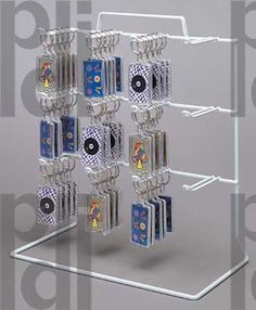 a clear display case holds eight cards and four dices in each holder, which is attached to a metal hook