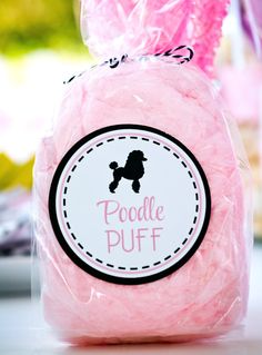 a pink plastic bag with a black poodle on it and the words poodle puff