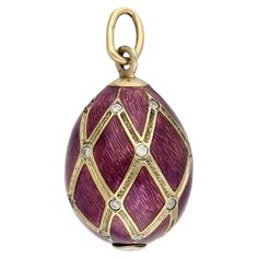 This exquisite purple egg pendant is a blend of luxury and elegance, crafted with meticulous attention to detail. The Fabergé style egg pendant is made from 14-karat yellow gold and gold-plated silver, ensuring both durability and a radiant finish. It features a vibrant purple enamel textured coating - also known as guilloche - that adds a touch of regal sophistication, complemented by sparkling zirconia throughout the egg that enhance its allure. Specifications: Materials: 14k gold and gold-pla Gold Egg, Textured Coat, Vibrant Purple, The Egg, Silver Enamel, Gold Plated Silver, Timeless Beauty, Jewelry Necklace Pendant, Violet