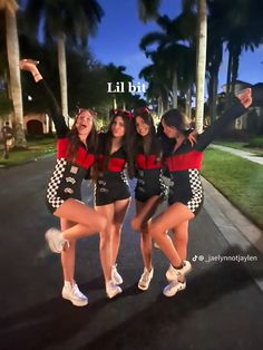 three girls are posing for the camera in front of some palm trees and one has her arms up