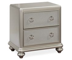 a silver nightstand with two drawers on each side