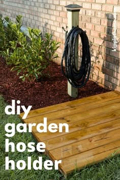 a diy garden hose holder in the grass