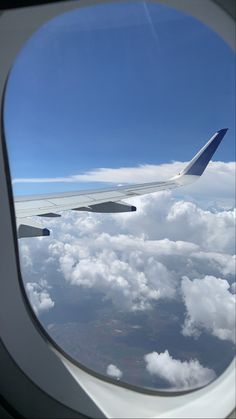 an airplane wing is seen through the window