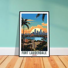 a poster on the wall in front of a blue wall with palm trees and a cityscape