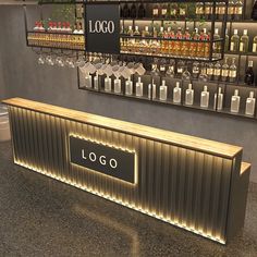 an empty bar with liquor bottles on the wall behind it and a sign that says logo