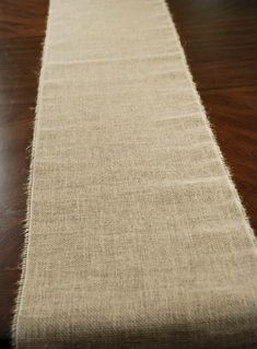 a long table runner on top of a wooden floor